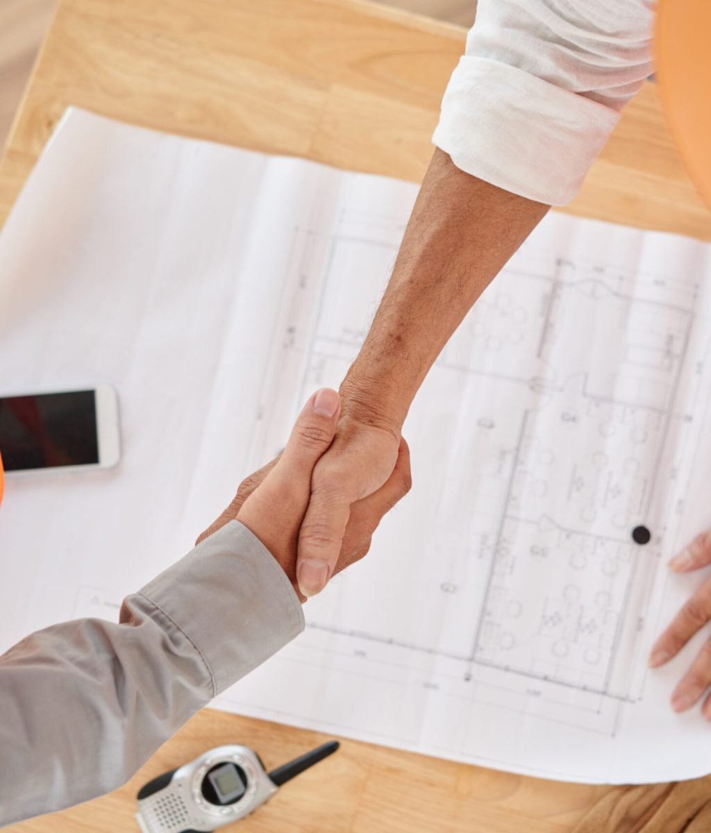 Firm handshake of contractor and head engineer